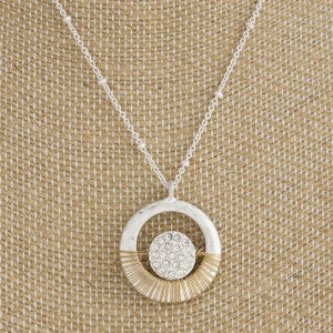Short metal necklace with wire wrapped pendant accented with rhinestones.