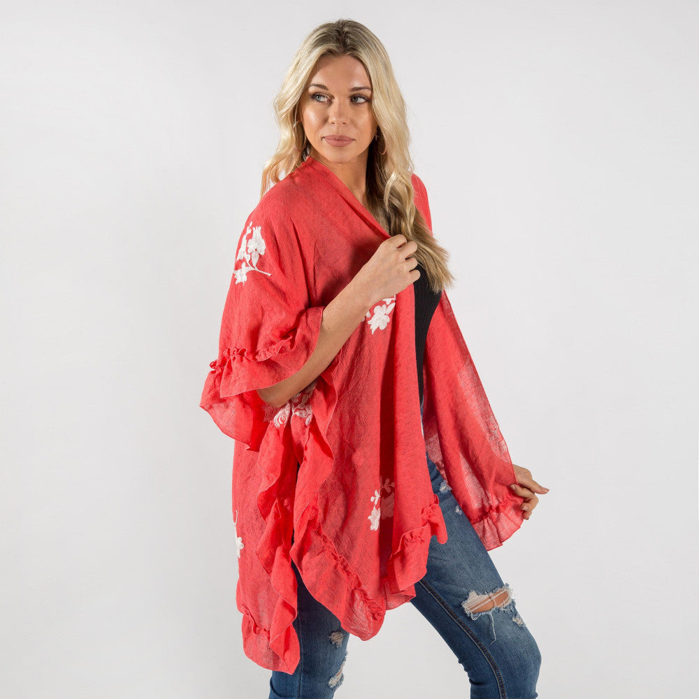 Coral Ruffled kimono with floral details.