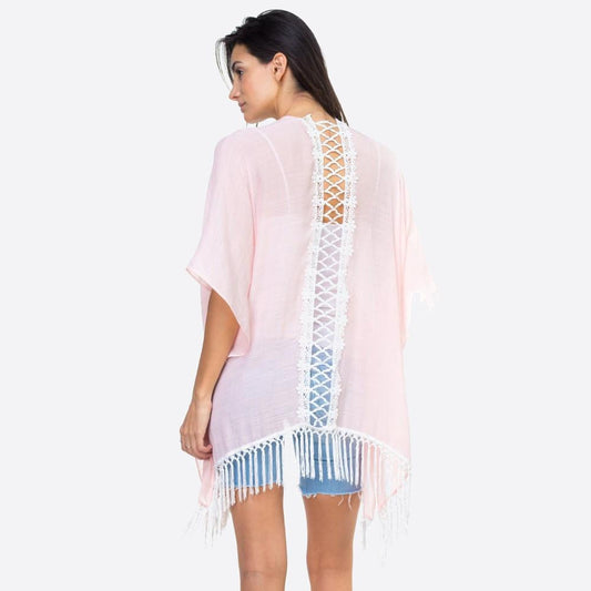 Pink kimono with lace down the back and fringe detail.