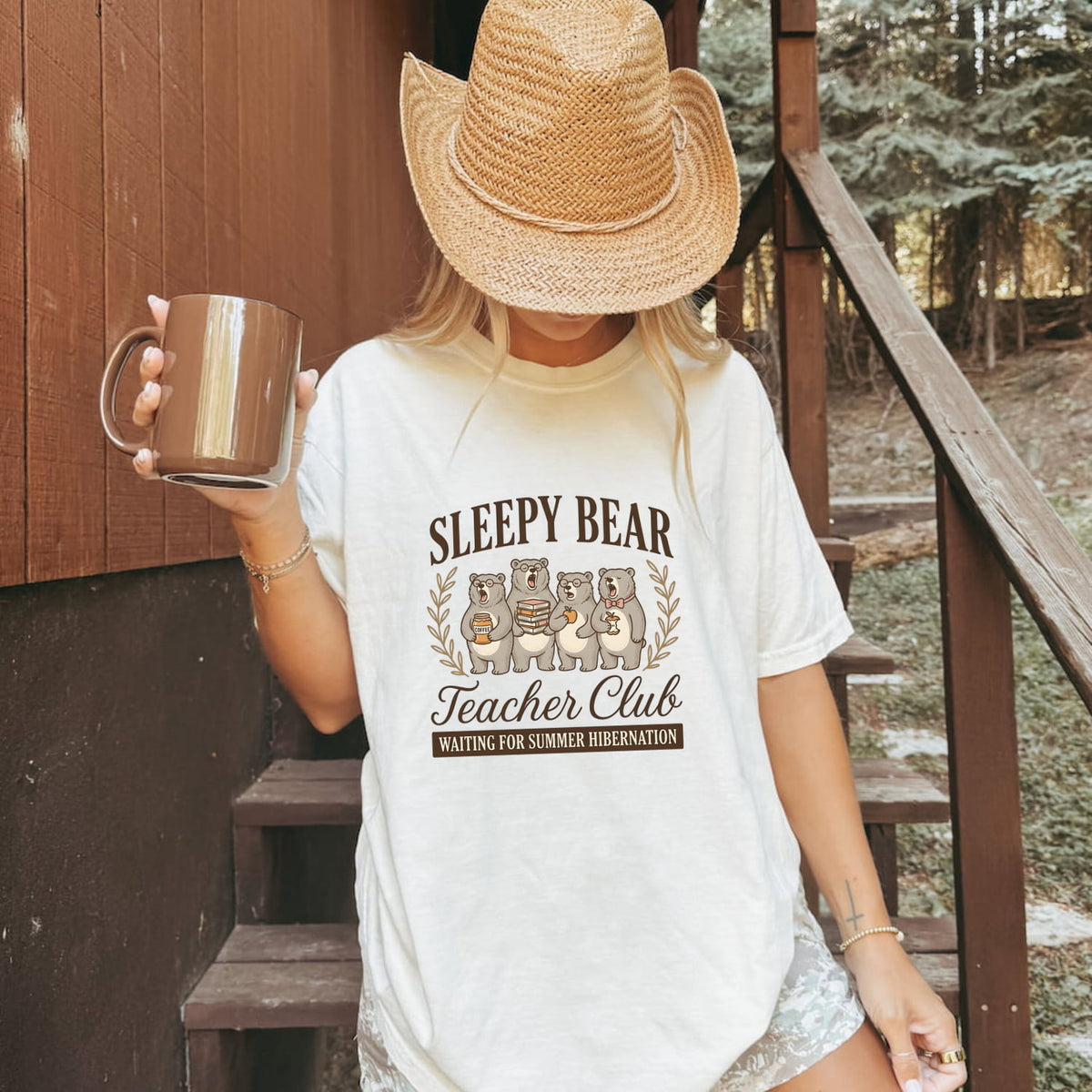 Sleepy Bear Teacher Club Text with an Iage of 4 Yawning Bears, and a humorous statement Waiting for Summer  Hibernation. The image shows the wite color t-shirt of a girl holding up a coffee cup.