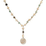 Gold tone, Y necklace with natural stone beads and a boho pendant.