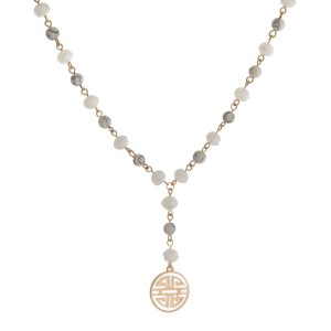 Gold tone, Y necklace with natural stone beads and a boho pendant.