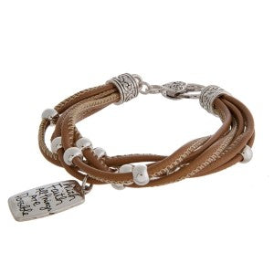 Faux leather bracelet with silver tone beads and a stamped charm.