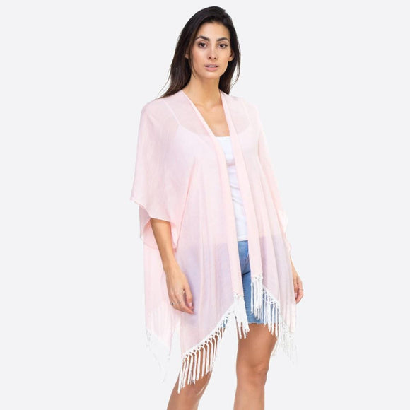 Pink kimono with lace down the back and fringe detail.