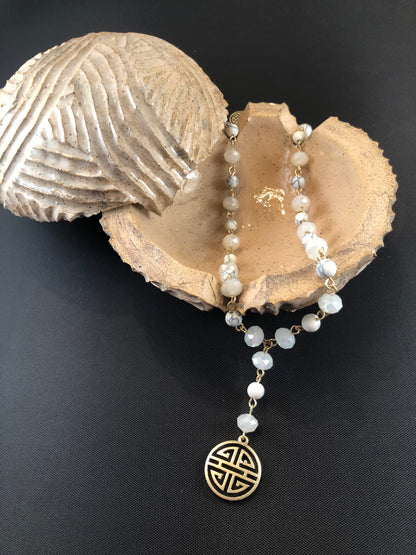 Gold tone, Y necklace with natural stone beads and a boho pendant.