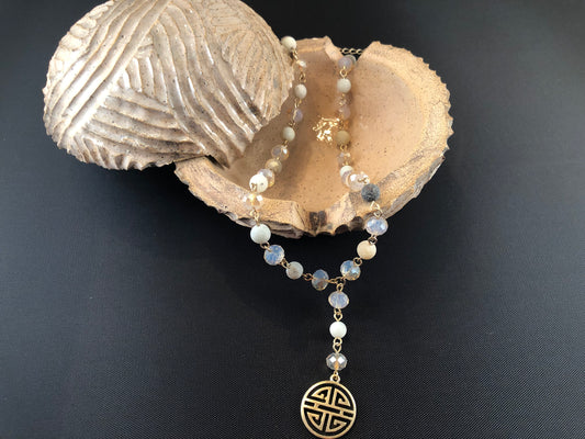 Gold tone, Y necklace with natural stone beads and a boho pendant.