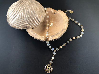 Gold tone, Y necklace with natural stone beads and a boho pendant.