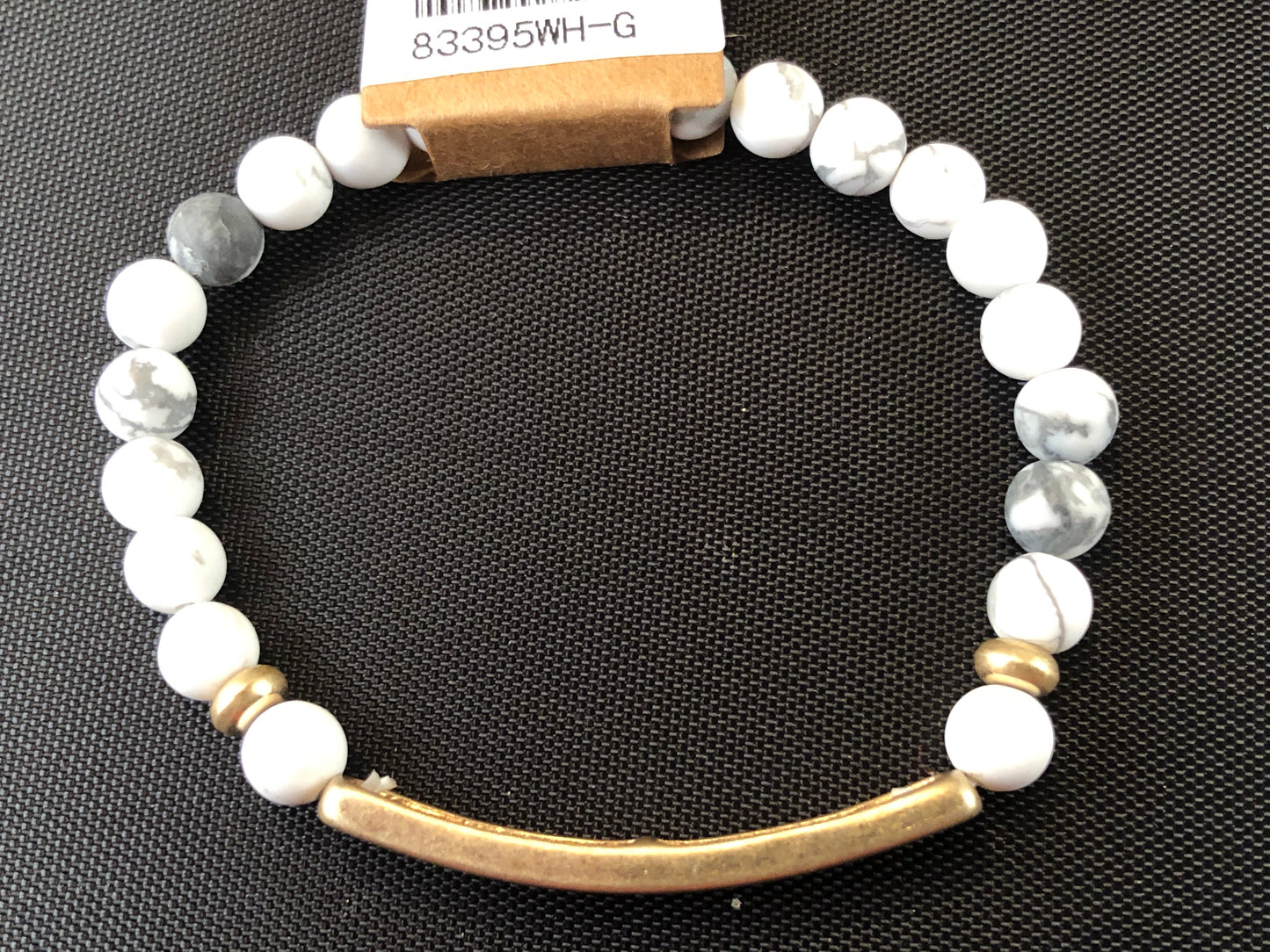 Beaded stretch bracelet with a bar focal, stamped with "blessed."