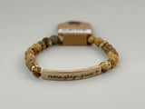 Beaded stretch bracelet with a bar focal, stamped with "amazing grace."